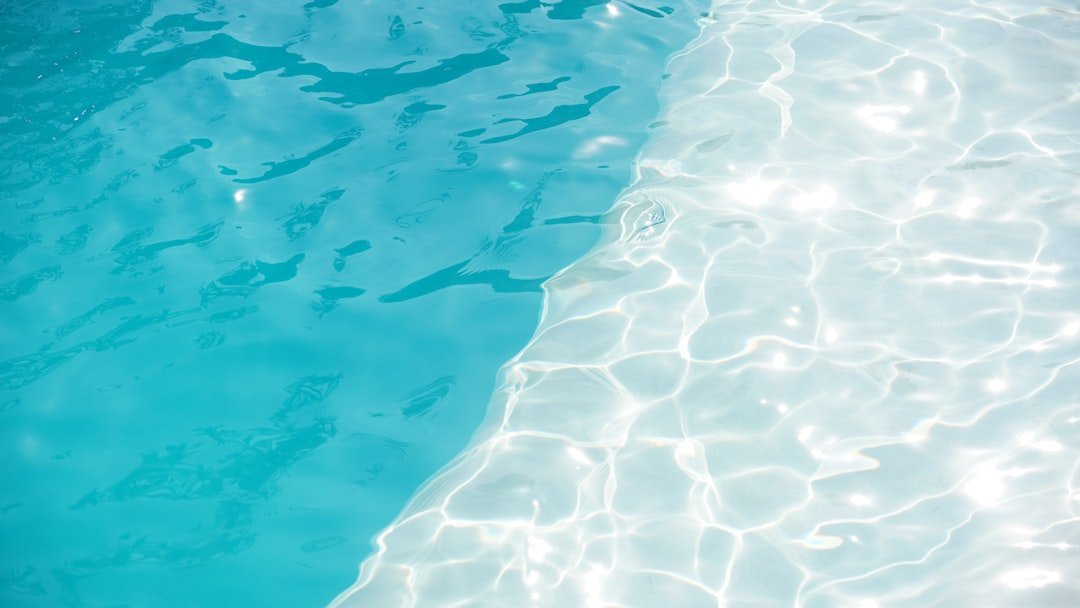 Sunlight on the surface of a clean swimming pool