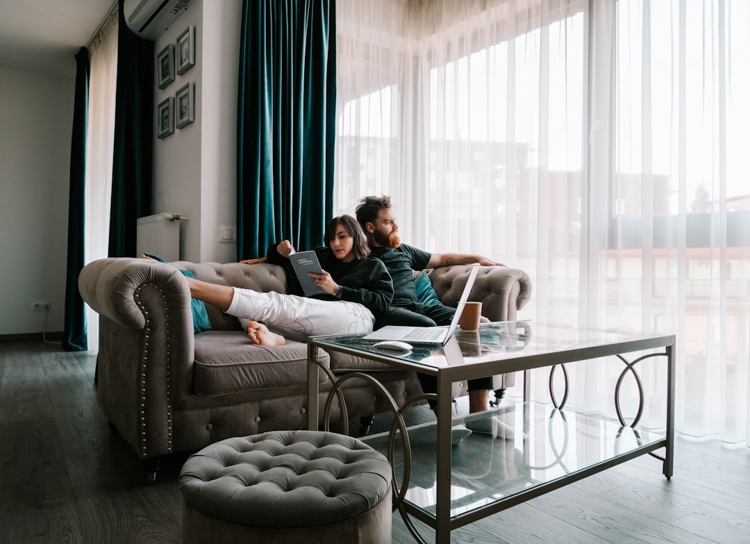 A couple at home using a laptop together