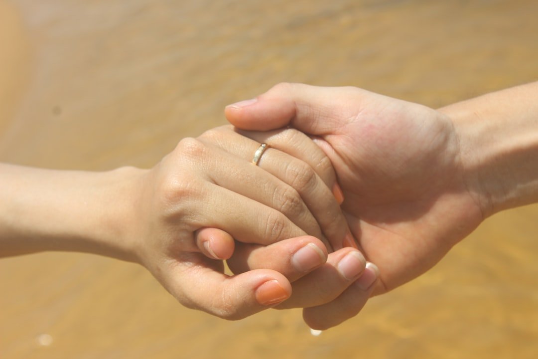 A couple in conversation, holding hands