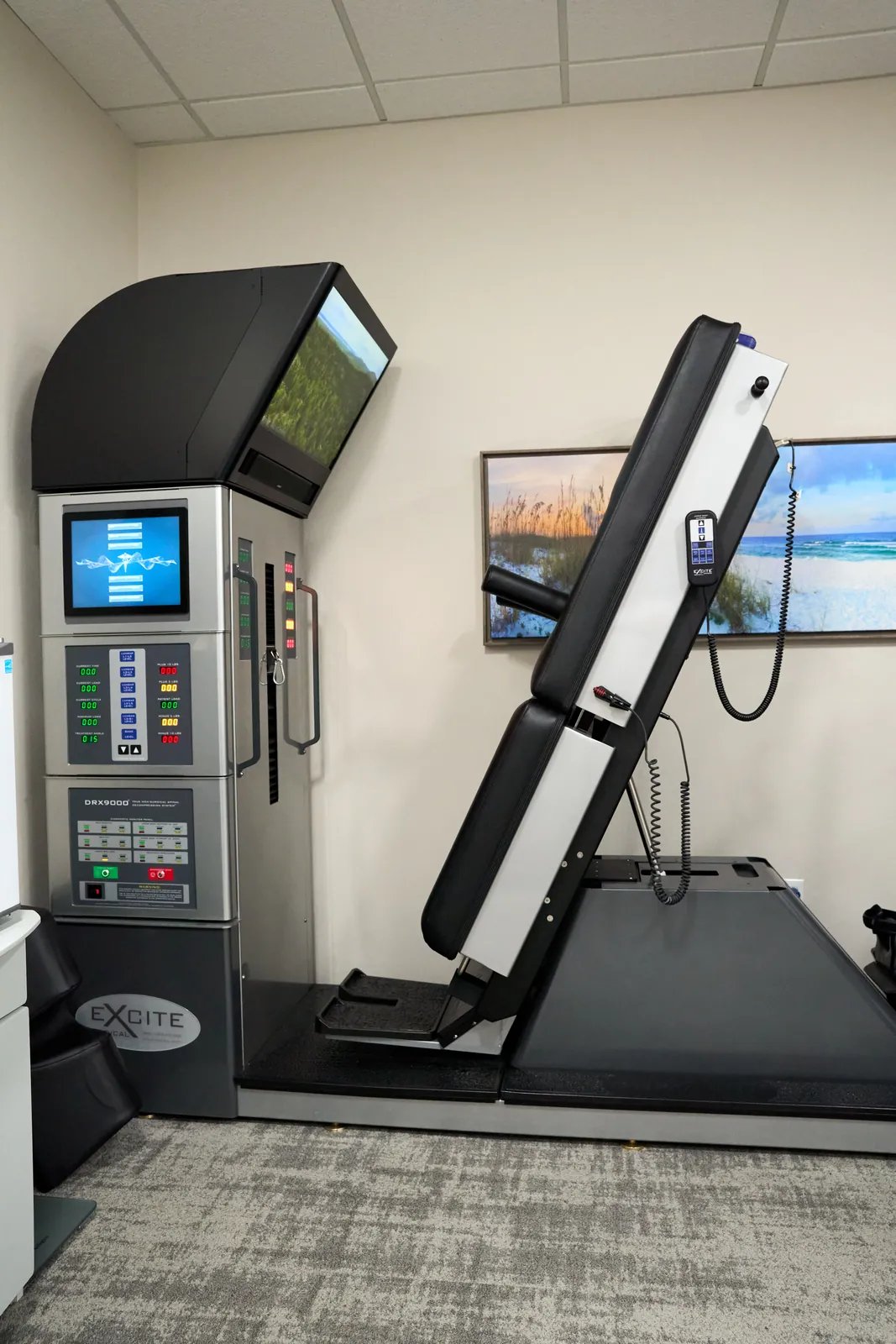 Non-surgical spinal decompression table in a treatment room at Novarè Injury Care and Rehab